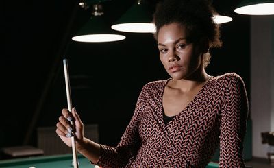 Person holding a difficult balance pose with confidence.